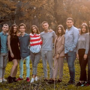 group of people standing on green grass field during daytime