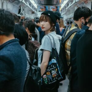 a group of people standing on a subway train