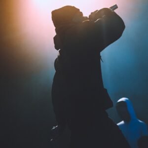 silhouette of man holding camera